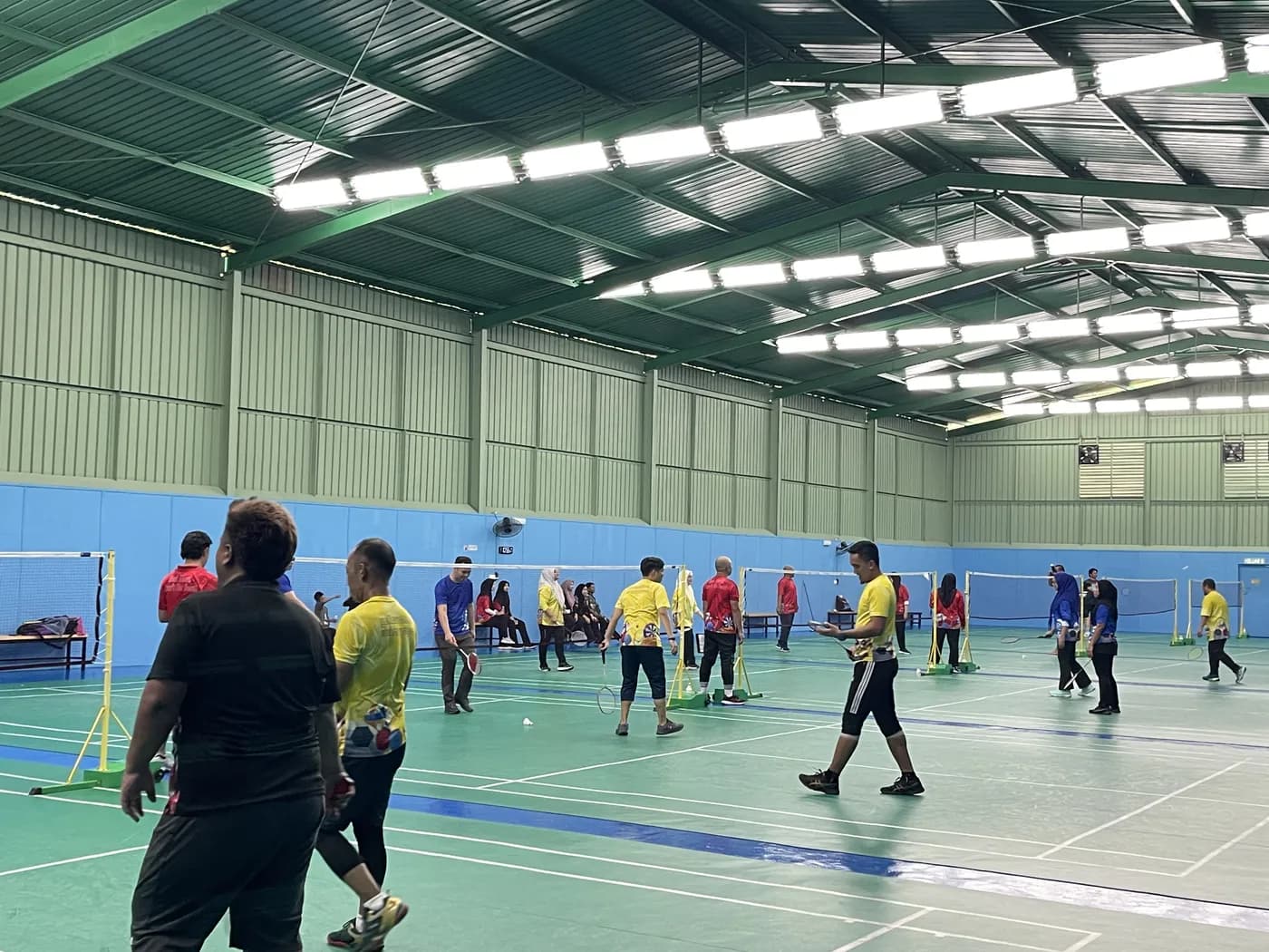 Players across several courts during a busy session